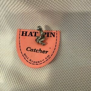 Baseball catcher pin to wear on the bill of your cap.